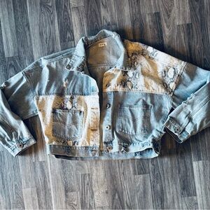 Women’s snake skin distressed jean jacket.